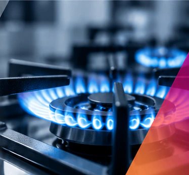 Modern gas cooktop with a blue flame